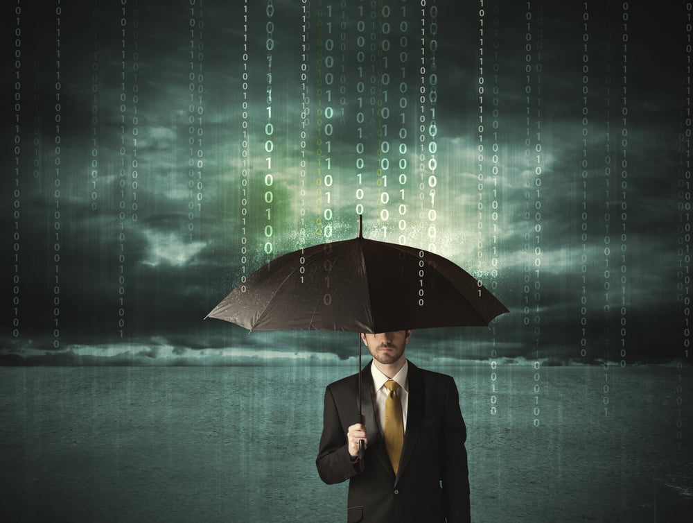 Business man standing with umbrella data protection concept on background